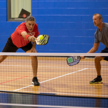 Two adults participating in activity